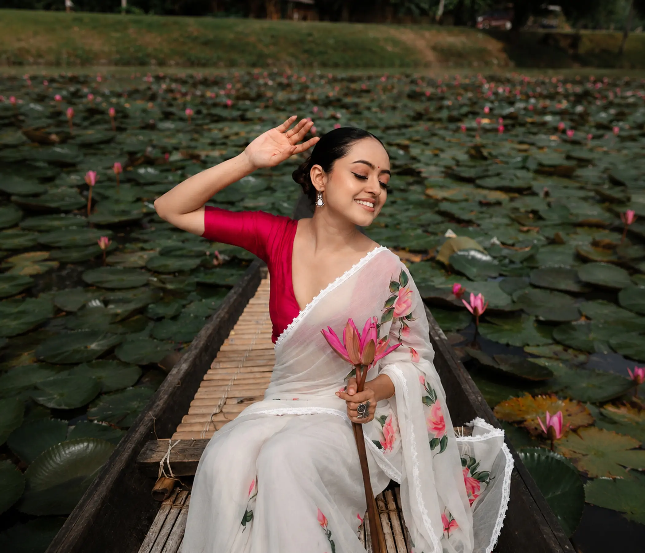 Hand-Painted Pristine White Organza Saree with Pink Lotus Motifs